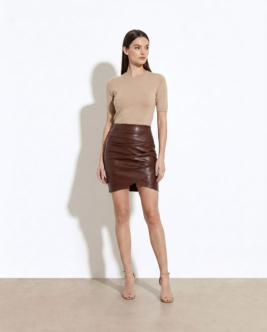 Ariadne Ruched Asymmetrical Hem Skirt — studio model shot