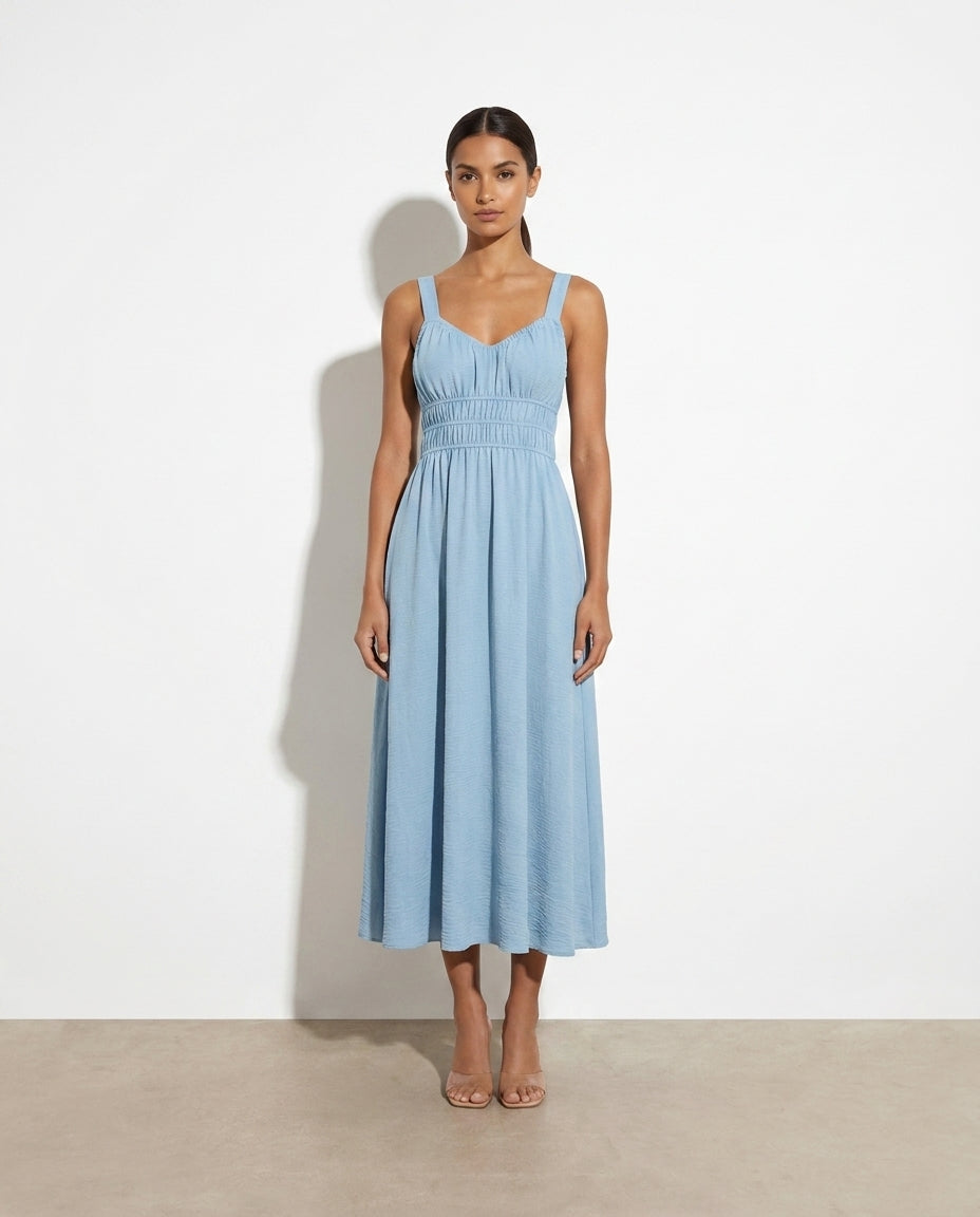 Cosette Sleeveless Smocked Midi Dress — studio model shot